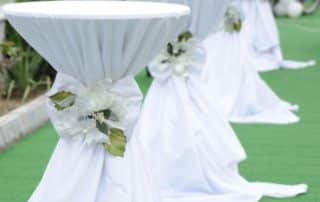 White Tablecloth Decorated Tables in Wedding