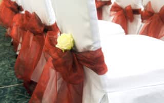 Red Bow with White Rose on Chairs Decoration