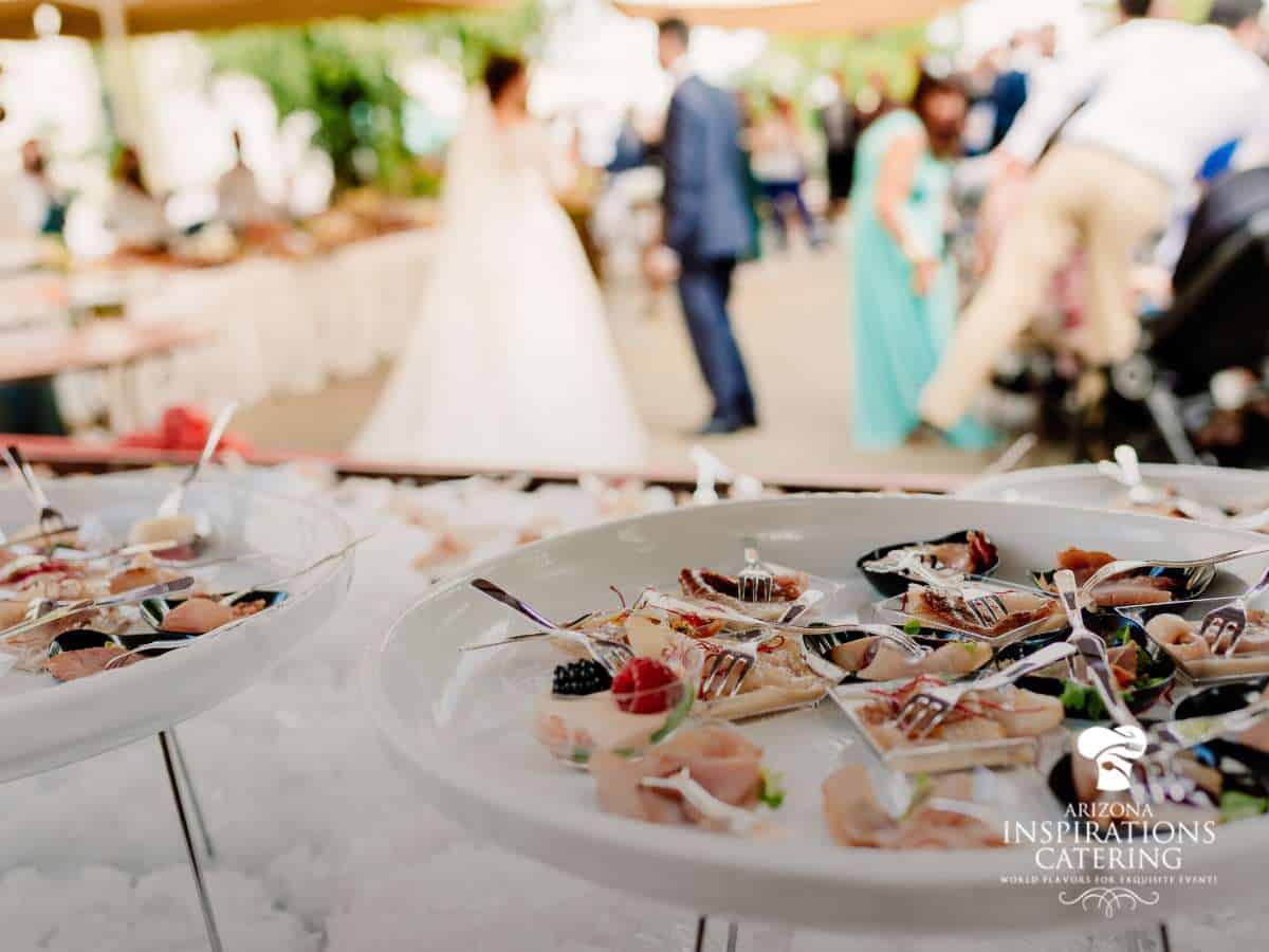 Elegant dishes served by a professional wedding caterer at a beautiful outdoor wedding reception