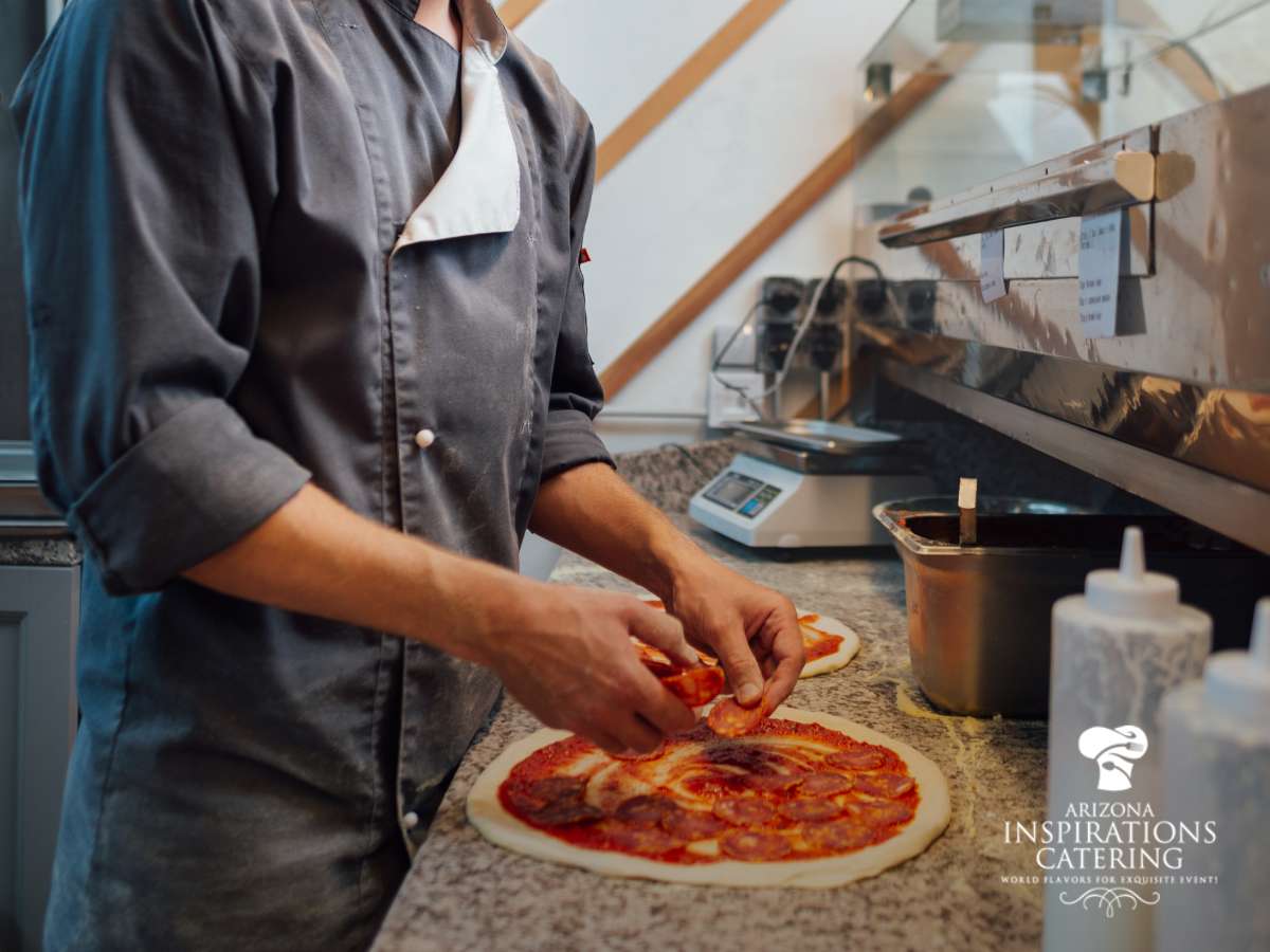 Chef preparing gourmet pizza for a personal chef catering service event